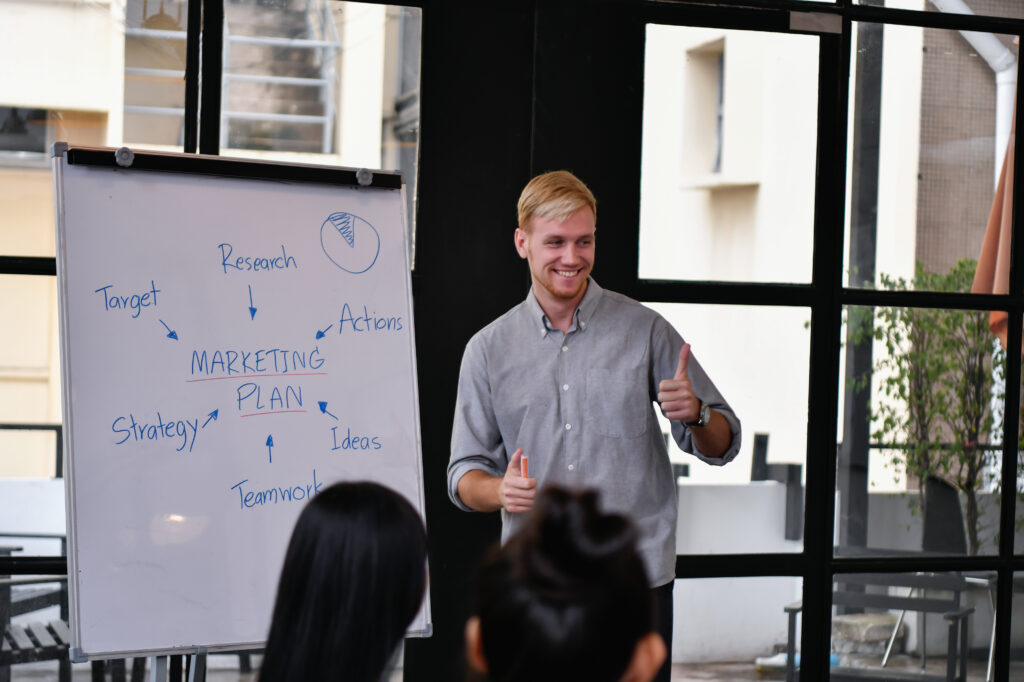 A young man getting into sales and presenting to others